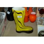 A yellow art glass wellington Boot with Laguna label attached.