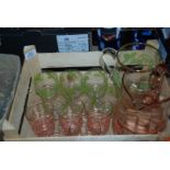 A lemonade set with green decoration and one other part lemonade set in pink glass,