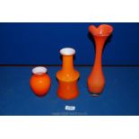 Three orange glass Vases.