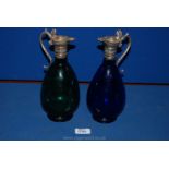 A pair of glass and plated Claret Jugs (one blue,