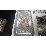 A SILVERED COPPER PERSIAN PLAQUE