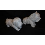 A PAIR OF STONE DOG FIGURES