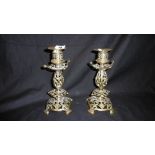 A PAIR OF BRASS ART NOUVEAU CANDLESTICKS