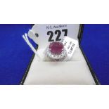 AN 18CT WHITE GOLD RUBY AND DIAMOND CLUSTER RING, RUBY 5.28CT, DIAMOND TOTAL 1.