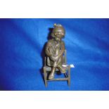 BRONZE FIGURE OF A GIRL ON STOOL