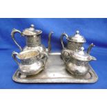 A FOUR PIECE SILVER PLATED TEA SET ON TRAY A/F