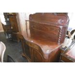 A VICTORIAN MAHOGANY SERPENTINE CHIFFONIER