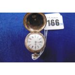 A SWISS ROSE METAL MARKED 14K ENGINE TURNED LADIES HUNTER POCKET WATCH