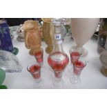 CRANBERRY GLASS DECANTER PLUS FIVE GLASSES