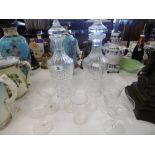 A PAIR OF CUT CRYSTAL DECANTERS AND A PART SUITE OF ETCHED GLASSES,