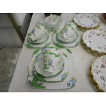 AN ART DECO FLORAL DECORATED SIX PLACE SETTING TEA SET (NO TEA POT)