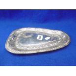 AN INDIAN WHITE METAL DISH