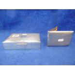 A HM SILVER ENGINE TURNED CIGARETTE BOX AND A WHITE METAL MARKED SILVER CIGARETTE BOX (UNTESTED)