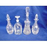 FOUR CUT GLASS DECANTERS