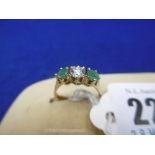 EMERALD AND DIAMOND THREE STONE RING,