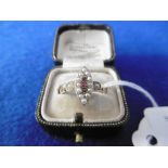 A VICTORIAN 18CT SEED PEARL AND RUBY MARQUISE SHAPE RING IN PERIOD BOX SIZE O