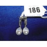 A PAIR OF WHITE PEARL AND DIAMOND EARRINGS