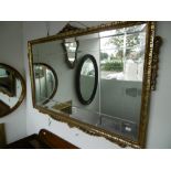 A RECTANGULAR DECORATIVE MIRROR