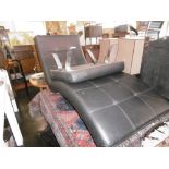 A CONTEMPORARY LEATHER CHAISE LOUNGE AND MATCHING FOOT STOOL