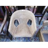 A LLOYD LOOM WICKER ARMCHAIR