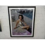 A FRAMED AND GLAZED SIGNED PHOTOGRAPH OF JANE RUSSELL WITH AUTHENTICATION