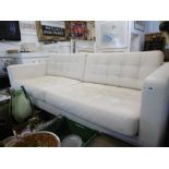 A WHITE LEATHER RETRO STYLE SOFA