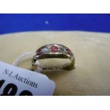 A LATE VICTORIAN 18CT GOLD RUBY AND DIAMOND FIVE STONE RING