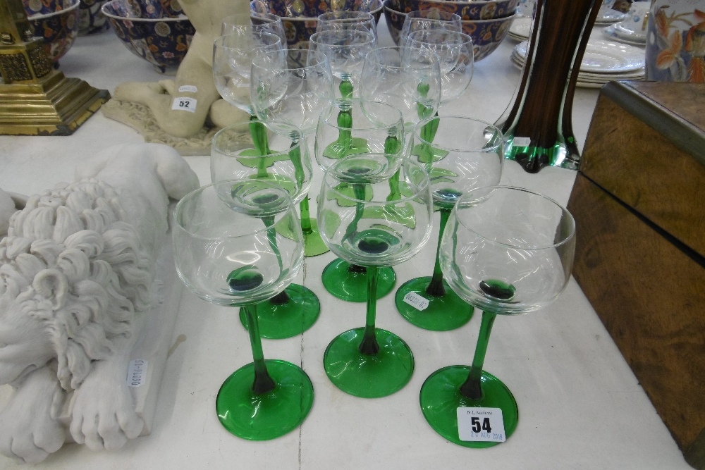 A SET OF EIGHT ACID ETCHED TALL GREEN STEM HOCK GLASSES AND A SET OF SIX TALL STEM GREEN GLASSES