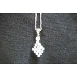 A YELLOW AND WHITE METAL DIAMOND AND PEARL PENDENT ON 14CT WHITE GOLD CHAIN