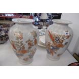 A PAIR OF DECORATIVE PORCELAIN VASES