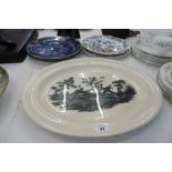 A WEDGEWOOD MEAT CHARGER AND FOUR ROYAL DOULTON PLATES