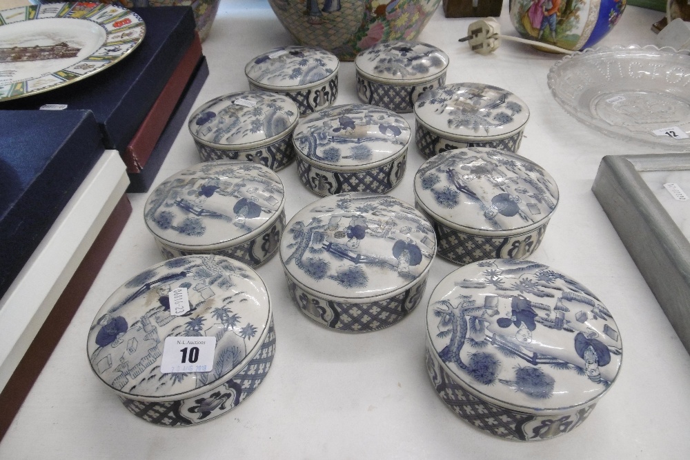 TEN BLUE AND WHITE LIDDED CONTAINERS