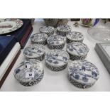 TEN BLUE AND WHITE LIDDED CONTAINERS