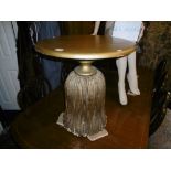 A GILT TASSEL TABLE