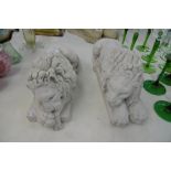 A PAIR OF RECUMBENT LIONS