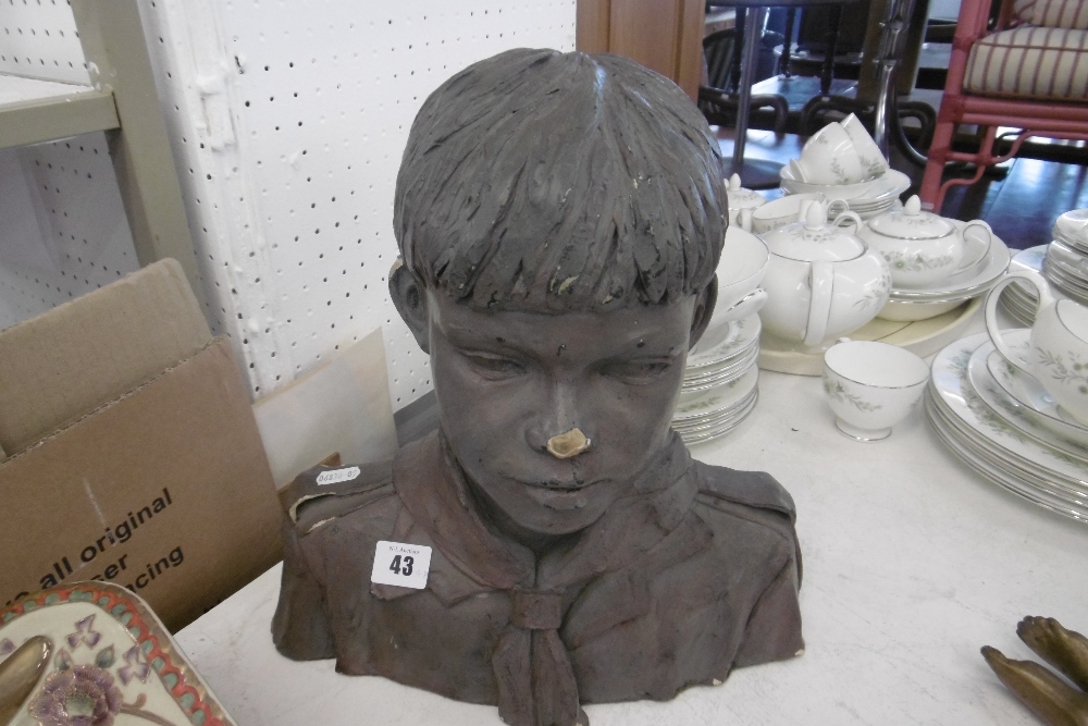 A SIGNED BUST OF A BOY SCOUT