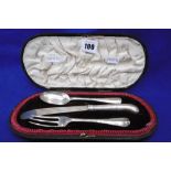 A BOXED THREE PIECE SILVER BOXED KNIFE SPOON AND FORK