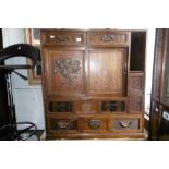 A LATE 19TH/EARLY 20TH CENTURY ORIENTAL CABINET WITH LACQUERED PANELS