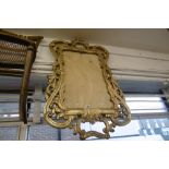 A GILT WOOD MIRROR FRAME