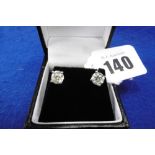 A PAIR OF DIAMOND STUD EARRINGS TOTAL WEIGHT 2.