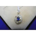 A 14CT YELLOW GOLD DIAMOND AND TANZANITE PENDENT