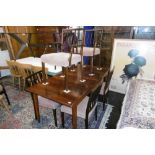 A ROSEWOOD TABLE AND SIX CHAIRS