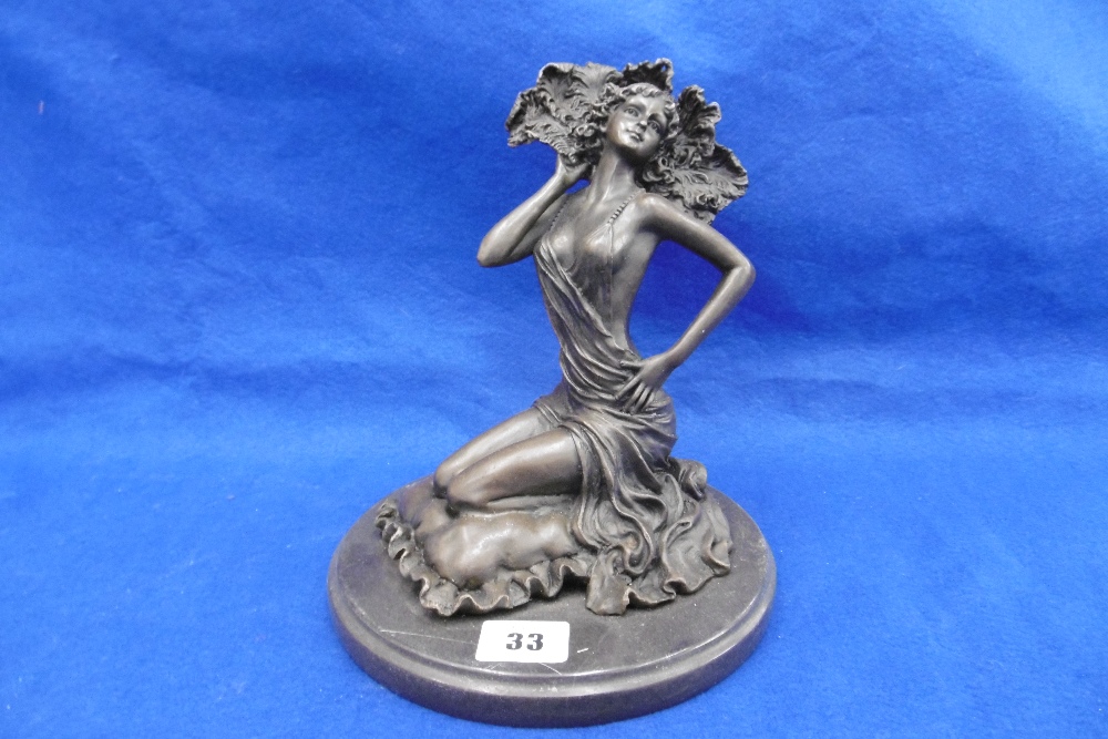 BRONZE LADY ON A ROUND MARBLE BASE