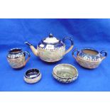 A ROYAL DOULTON THREE PIECE LAMBETH TEA SET AND TWO OTHER PIECES OF LAMBETH WARE