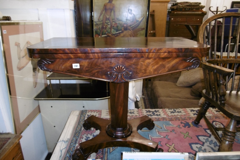 A WILLIAM IV ROSEWOOD FOLD OVER CARD TABLE ON CARVED FEET