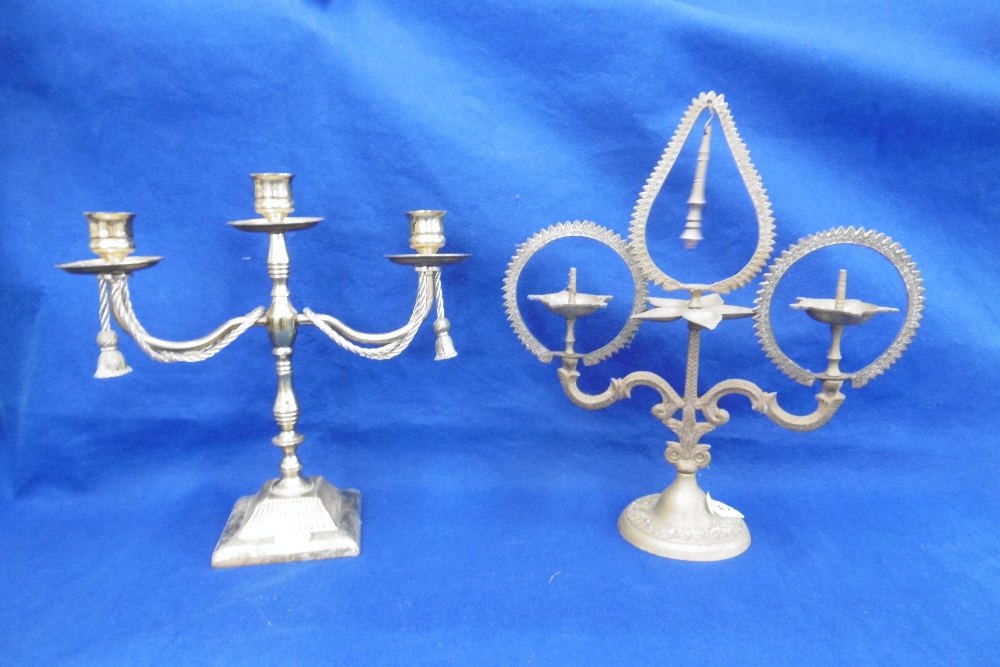 A BRASS CANDLEARBRA AND ONE OTHER