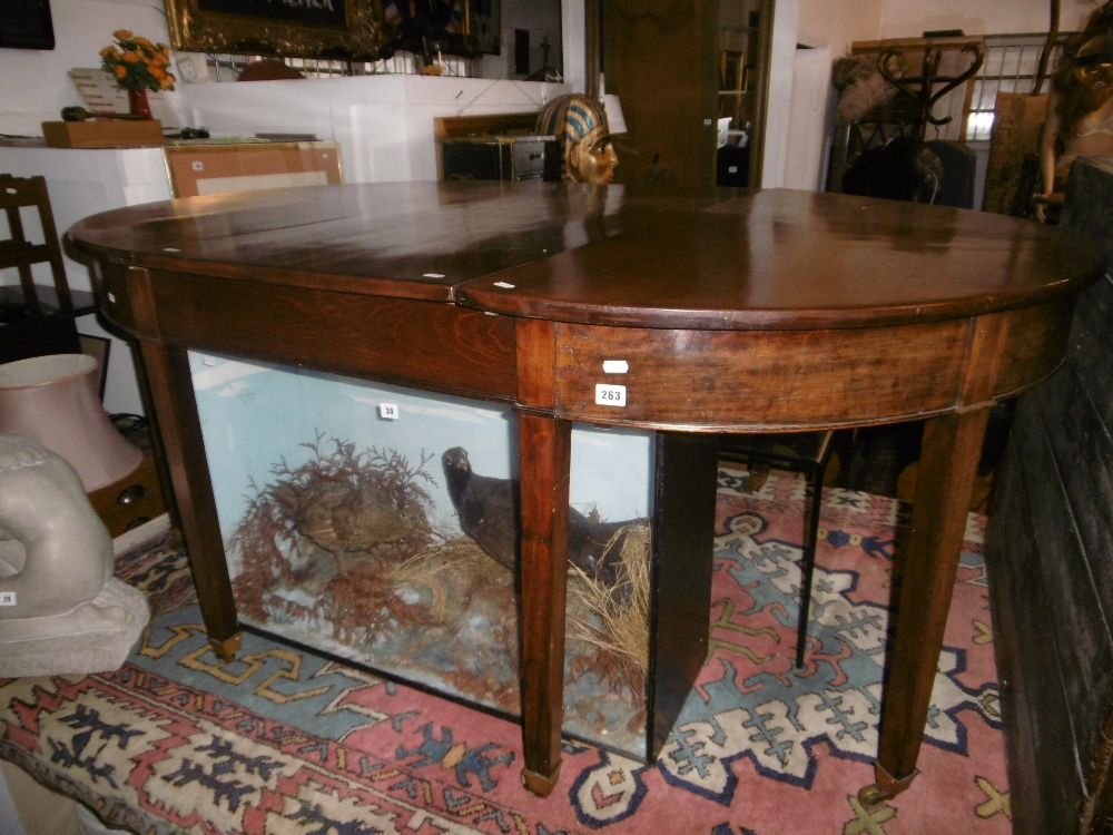 A GEORGE III MAHOGANY D END DINNING TABLE