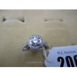 A PLATINUM AND DIAMOND HALO SET RING CENTRE STONE APPROXIMATELY 0.