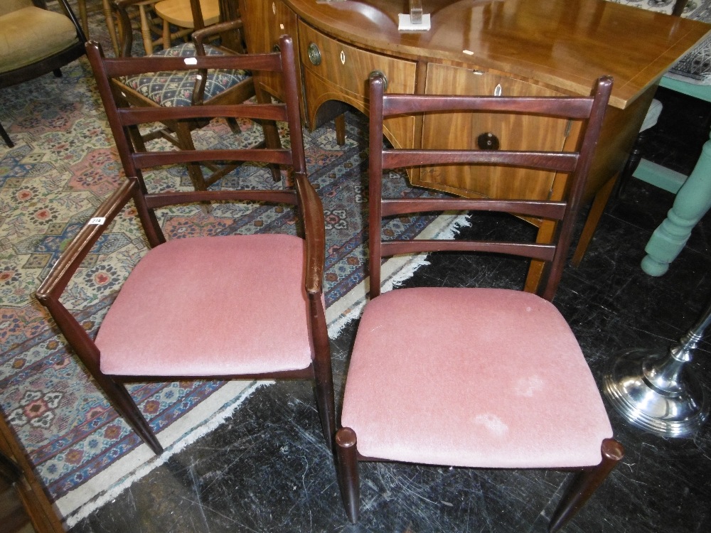 A SET OF SIX LADDER BACK DINING CHAIRS AND CARVER