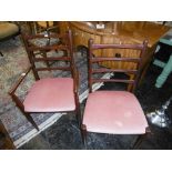 A SET OF SIX LADDER BACK DINING CHAIRS AND CARVER